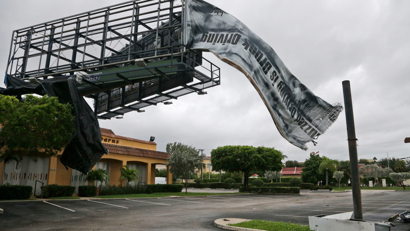 A billboard canvas flaps in the wind after Hurricane Matthew passed off shore, Friday, Oct. 7, 2016, in North Palm Beach, Fla. Matthew was downgraded to a Category 3 hurricane overnight with the strongest winds of 120 mph just offshore as the storm pushed north, threatening hundreds of miles of coastline in Florida, Georgia and South Carolina. (Image: AP)